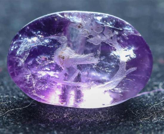 The amethyst seal found in a Jerusalem sewer may be the first artifact ever to depict the Biblical persimmon plant.     Source: Eliyahu Yanai / City of David