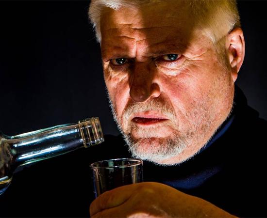 Man drinking alcohol. Credit: Rainer Fuhrmann / Adobe Stock