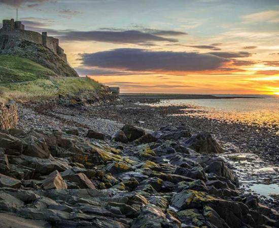 Lindisfarne Castle on the Holy Island of Lindisfarne is currently part of crowdfunded archaeological digs through DigVentures, and their most recent find were prayer beads made from salmon vertebrae. Source: Chris Combe / CC BY 2.0