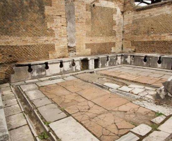 Ruin of a second-century public toilet in Roman Ostia.