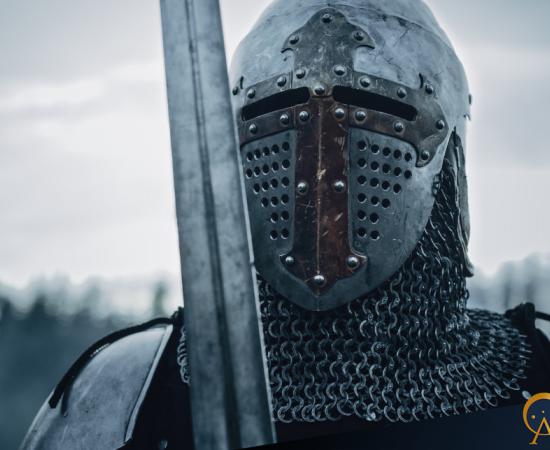 Medieval knight wearing armor, ready to fight in battle.