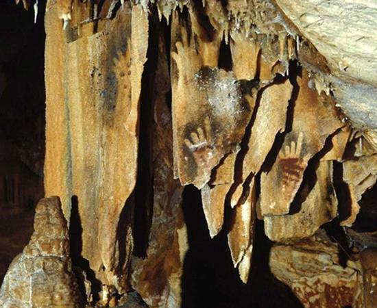 Hand images at Cosquer Cave. Researchers believe that Upper Paleolithic cave art depicting hands missing fingers may be explained by prehistoric ritual amputation practices.