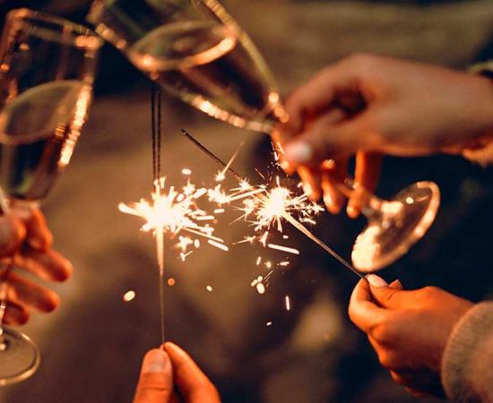 Toasting with champagne and sparklers is a New Year’s tradition, or is it a ritual? Source: Valerii/Adobe Stock
