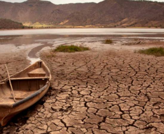 Dried up lake with boat, a scene now more common due to climate change. Source: maxcam / Adobe Stock