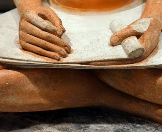 Detail of a seated Scribe sculpture