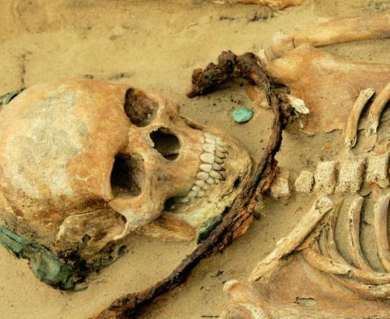 A girl age 14 to 19 was buried with a sickle across her throat, a copper headband and a coin near her mouth; the authors of a new study said her community may have thought she had demonic tendencies. 