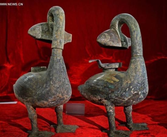 Chinese archeologists excavated two ancient smoke-absorbing bronze lamps that are believed to be about 2,000 years old. Experts said the artifacts may have been the world's first eco-friendly lamps. 
