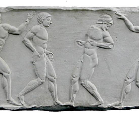  An ancient Greek relief from approximately 500 BC, with two teams at a ball game. The player on the left edge of the picture throws the ball, the team on the right is ready to defend. 