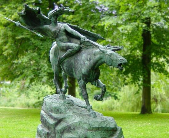 A statue of a Norse valkyrie, or battle maiden, on a horse in a park in Copenhagen, Denmark