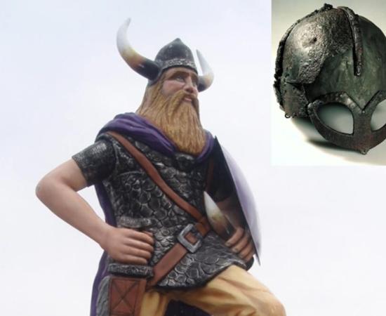 A modern statue of a Viking with the mythical horned helmet 