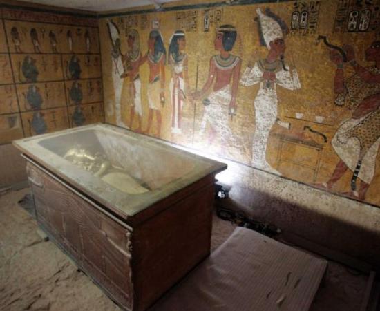 The stone sarcophagus containing the mummy of King Tut is seen in his underground tomb. 