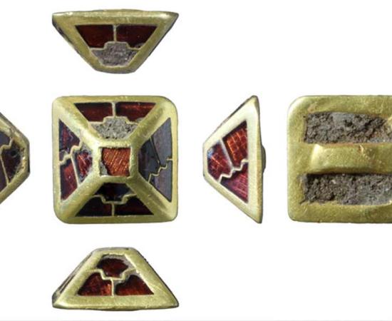 The gold and garnet sword harness pyramid found in Norfolk, England.