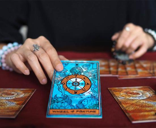 Tarot card reading. Credit: Benjavisa Ruangvaree / Adobe Stock