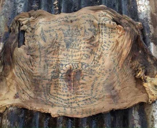 Locals in Thailand Village Claim Black Magic Tattoos Helped Preserve the Skin of a Corpse