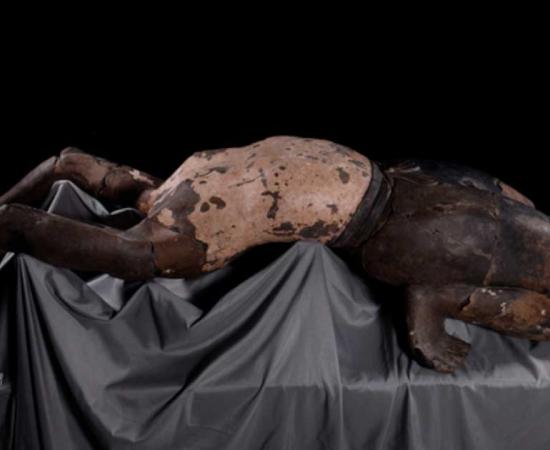 The terracotta figure represents an acrobat, created to provide entertainment in the afterlife for Emperor Qin Shi Huang. Source: Xinhua