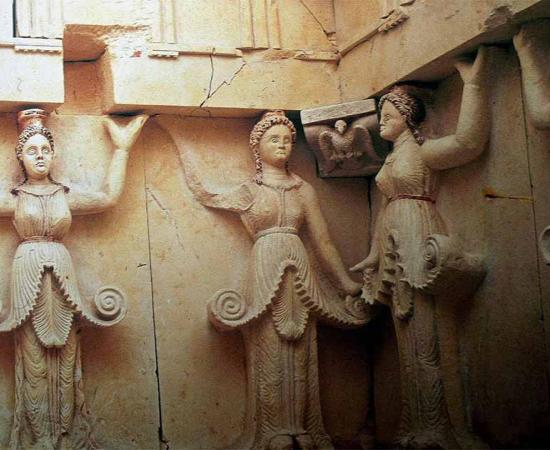 The half-human, half-plant caryatids in the tomb of Sveshtari; these sculpted female figures served as architectural support like a column in the stunning Thracian tomb design.             Source: Nenko Lazarov /  