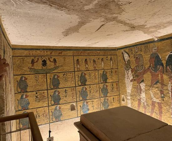Tutankhamun burial chamber and sarcophagus, showing lid of the sarcophagus broken in two.