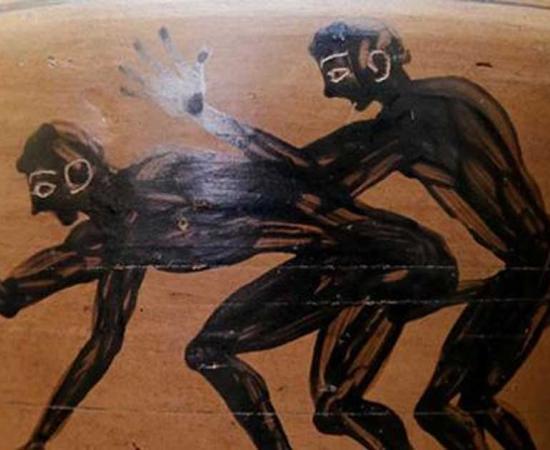 Two youths engaged in sex, one of them holding a hoop. Detail from an amphora