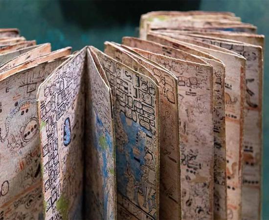 Mayan codex with hieroglyphic alphabet script writing system, Mexico City, Mexico. Source: SL-Photography / Adobe Stock.