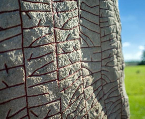 Close up of the Viking runestone (‘the Rök Stone’) from the 9th century, features the longest known runic inscription and is considered the first piece of Swedish literature.        Source: rolf_52 / Adobe stock