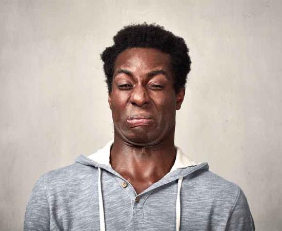 A man contorting his face at the idea of some of the weirdest foods in history. Source: Kurhan / Adobe Stock