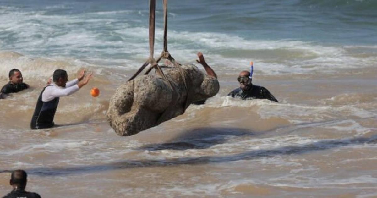 Divers raise the granite sphinx statue from Abu Qir Bay in Egypt.