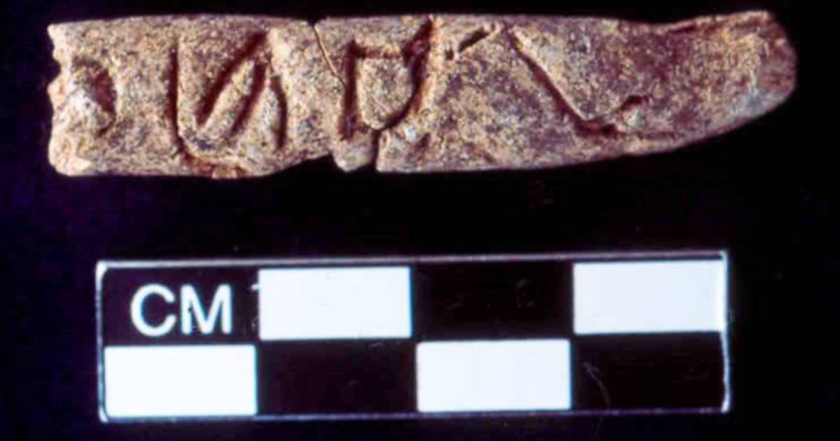 Clay object thought to contain early alphabetic writing.