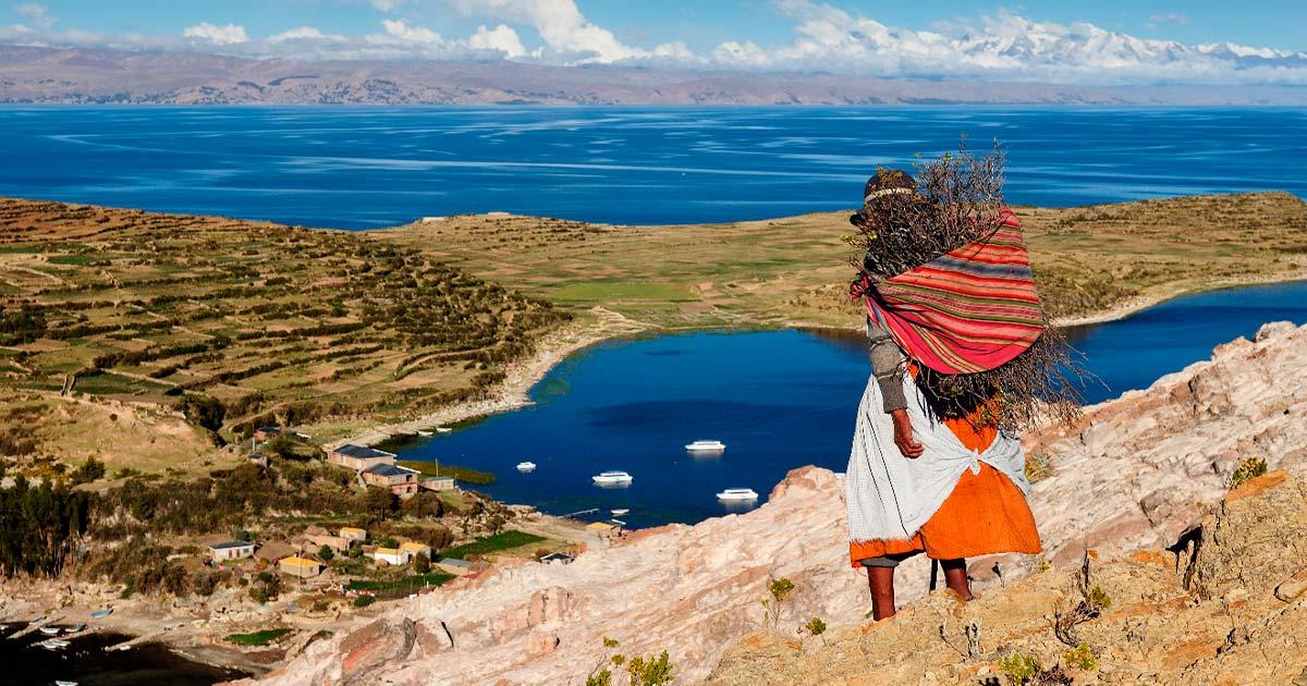 Aymara woman by the Titicaca Lake, collecting staples of an Andean Paleo diet.. Source: Rafal Cichawa/Adobe Stock