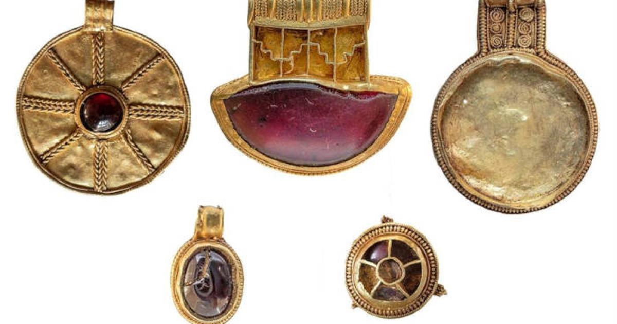 Four gold pendants and a gold-and-garnet brooch from the seventh century discovered in Lincolnshire, England