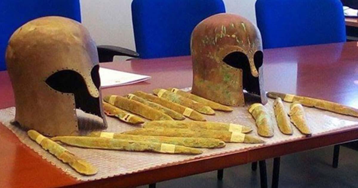 Some of the orichalcum ingots and the two Corinthian helmets found near a 2,600-year-old shipwreck off the coast of Sicily. 