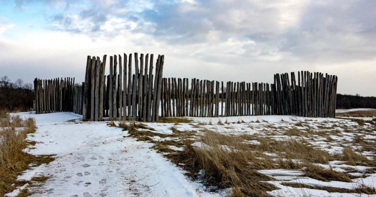 Fence surrounding the largest mound at Aztalan State Park. Source: Good Free Photos