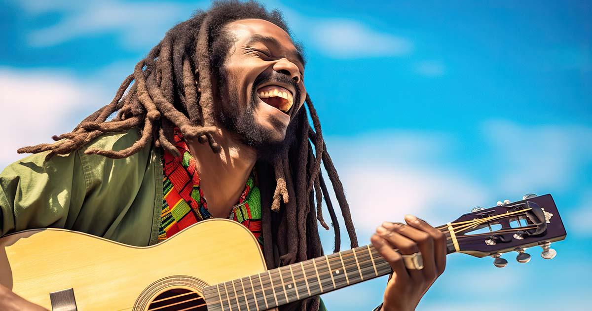 Rastafarian playing reggae music. Source: Victor / Adobe Stock