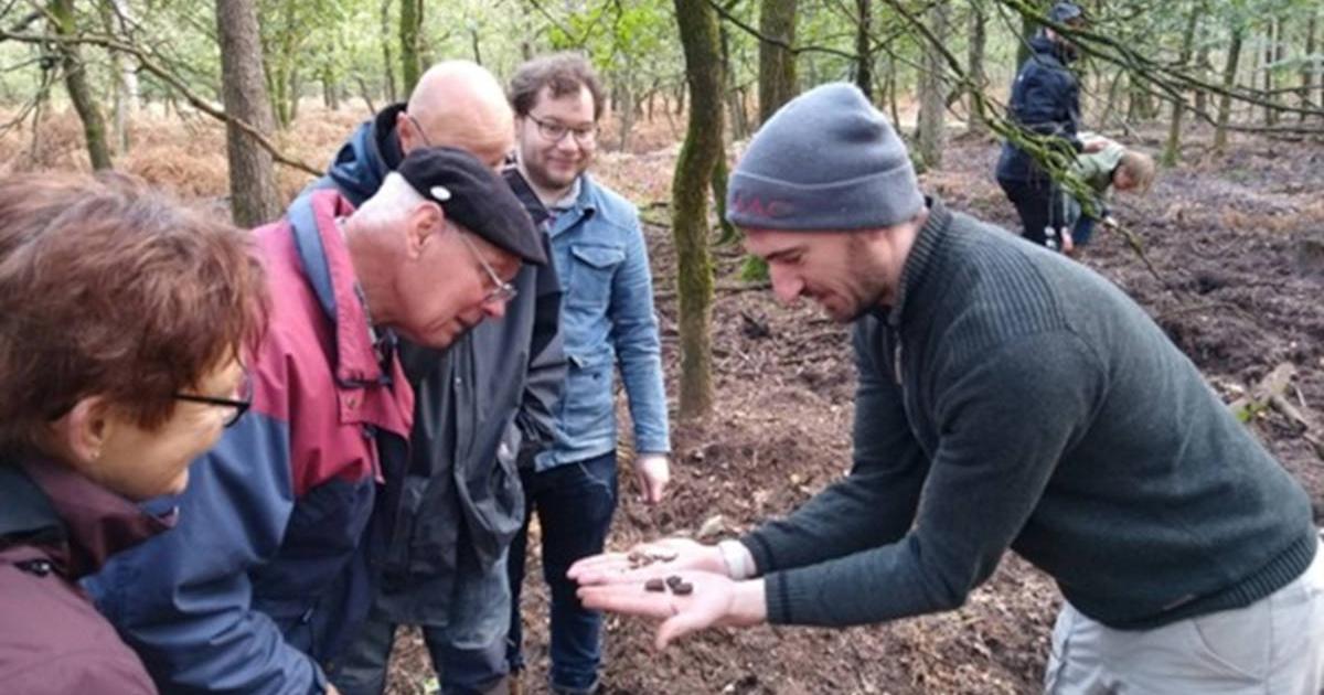 Dr Wouter Verschoof-van der Vaart with volunteers at one of the burial mounds identified during the project.
