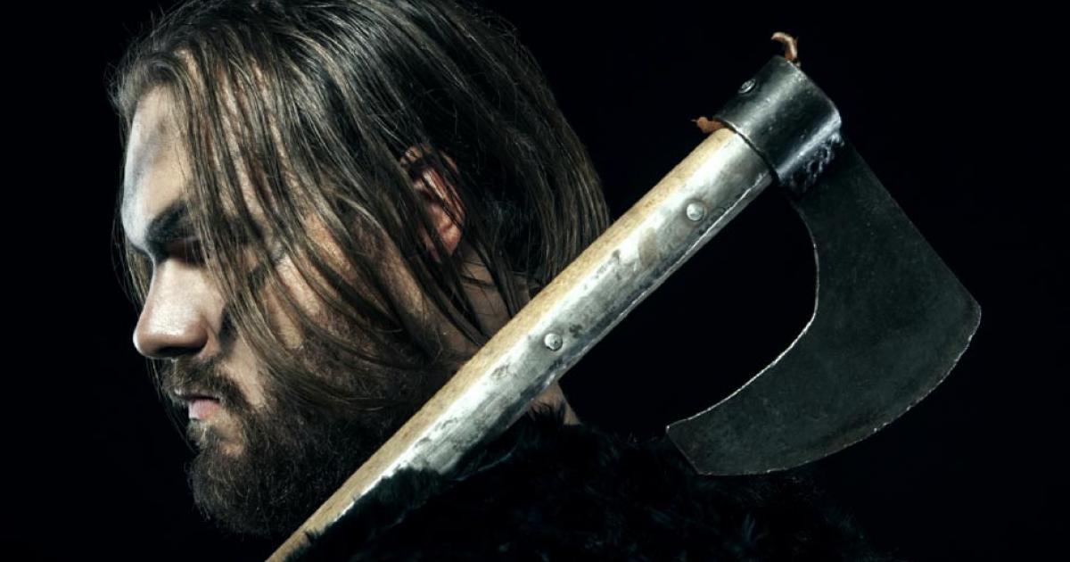Medieval battle reenactor defended his home using an ancient battle ax. Source: alexmina / Adobe Stock.