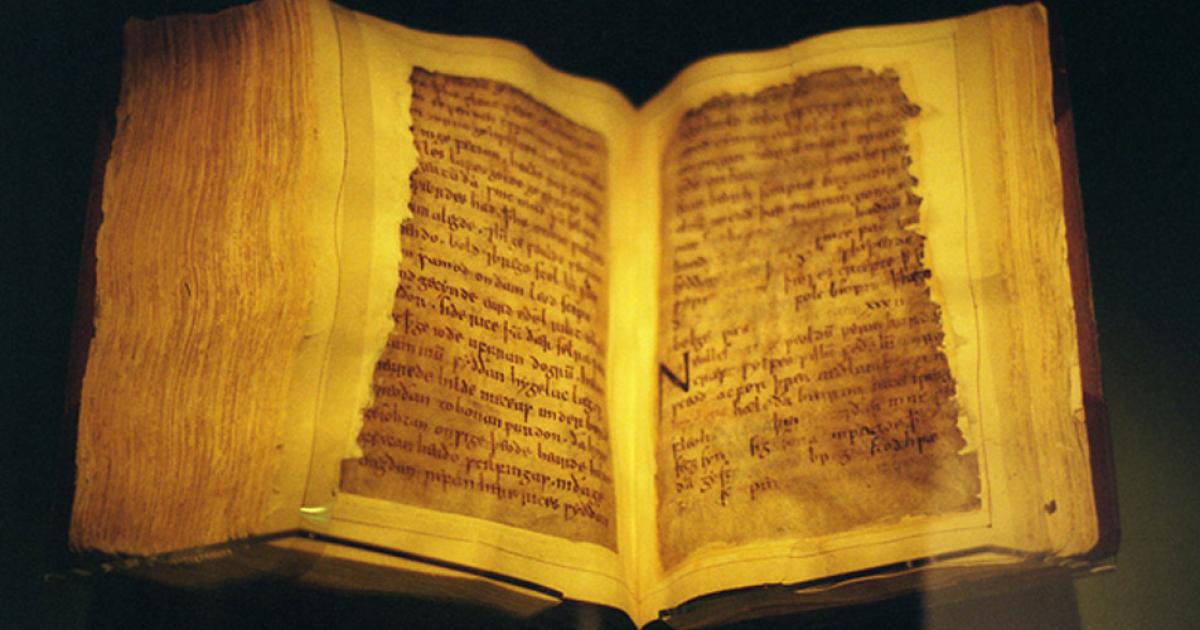 The codex, opened to a page of Beowulf