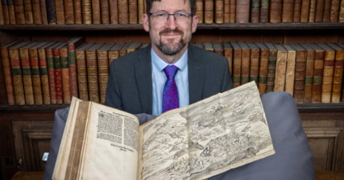 Nathan MacDonald with the Bible map in Trinity College's Wren Library