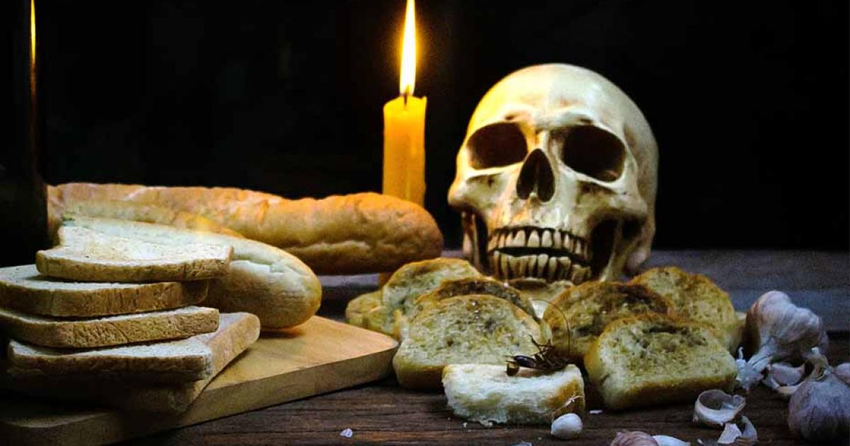 Human skull and bread. Source: Samitanun / Adobe Stock.