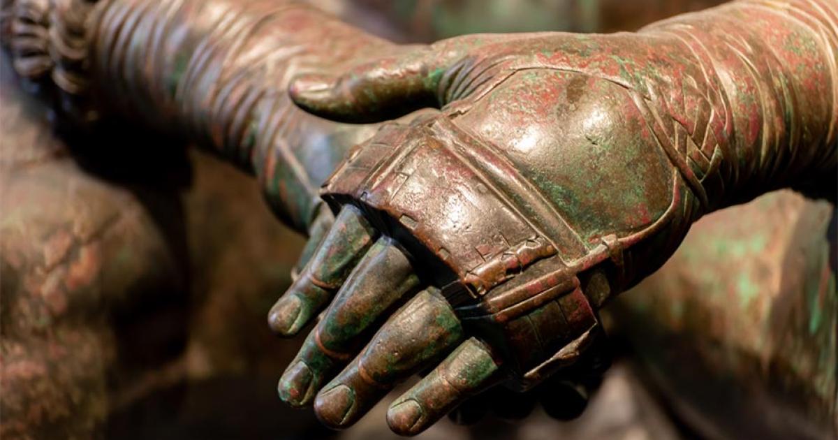 Details of an ancient Roman bronze statue. Credit: giorgio / Adobe Stock