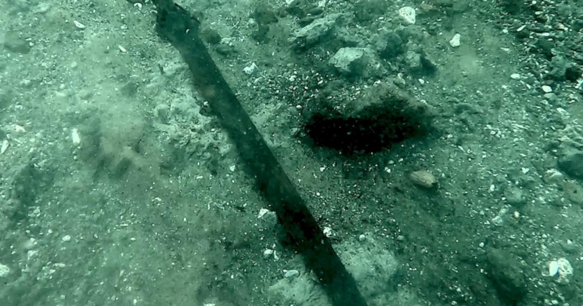 The 3,000-year-old bronze sword where it lay on the bed of Lake Mezzano 