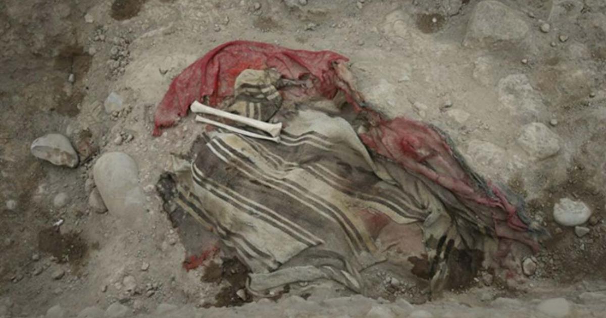Human remains and textile found in a burial at the Huaca Bellavista archaeological site in Peru.
