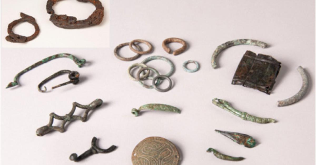 A set of small Gallic offerings and a pair of the Celtic iron shackles from Allonnes. 