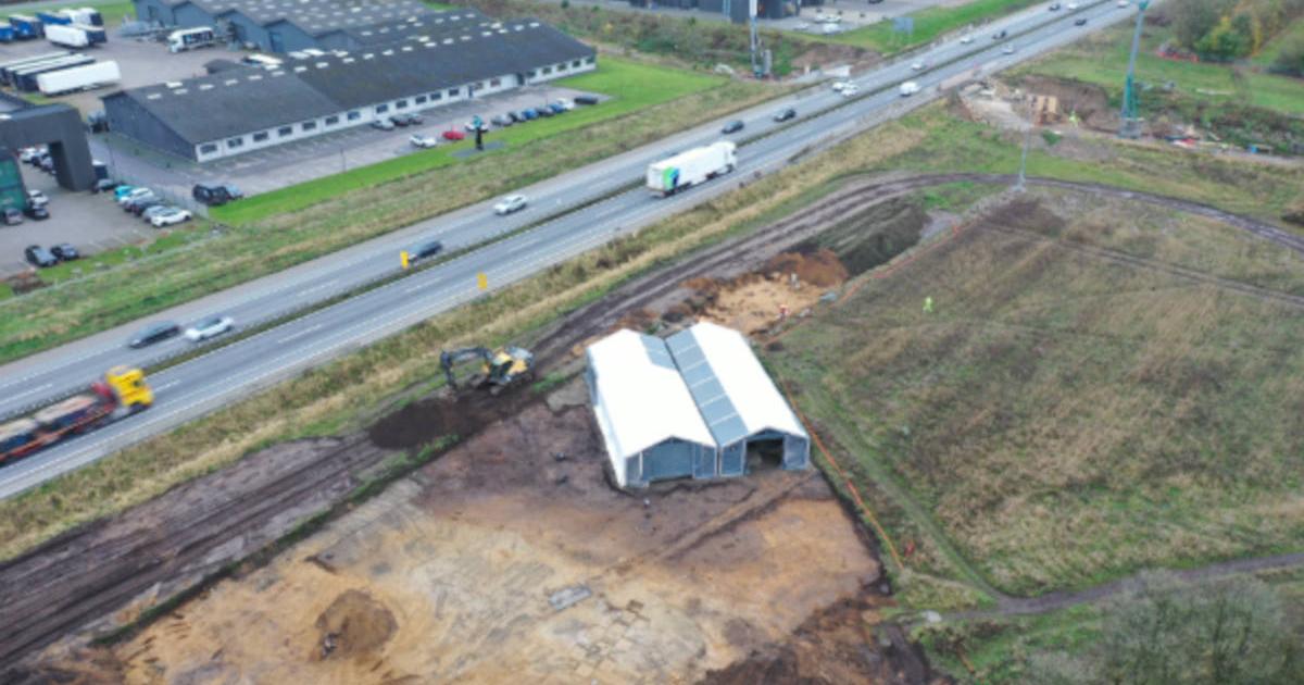 Aerial view of the Løsning Søndermark excavation site along a busy Danish motorway.