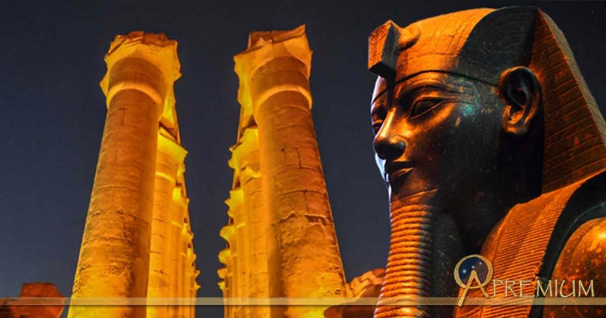 : The 14 columns of the The Colonnade of Amenhotep III - Luxor Temple and Statue of the Pharaoh
