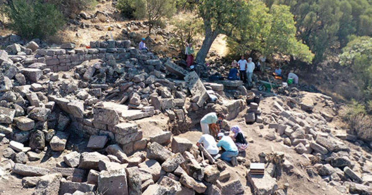 Aerial view of the Hellenistic temple excavation site at Aigai showing the two-room sanctuary structure. 