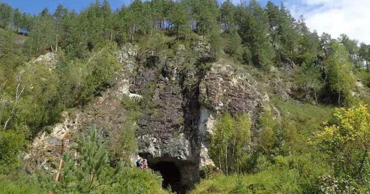 The entrance to the Denisova cave in the Altai Mountains of Siberia where the so-called new “Denisova Cave DNA” has proven, for the first time, the Neanderthals, Denisovans and Homo sapiens occupied the same cave at the same time sometimes!   Source: Professor Richard G. Roberts / University of Wollongong  By Ashley Cowie