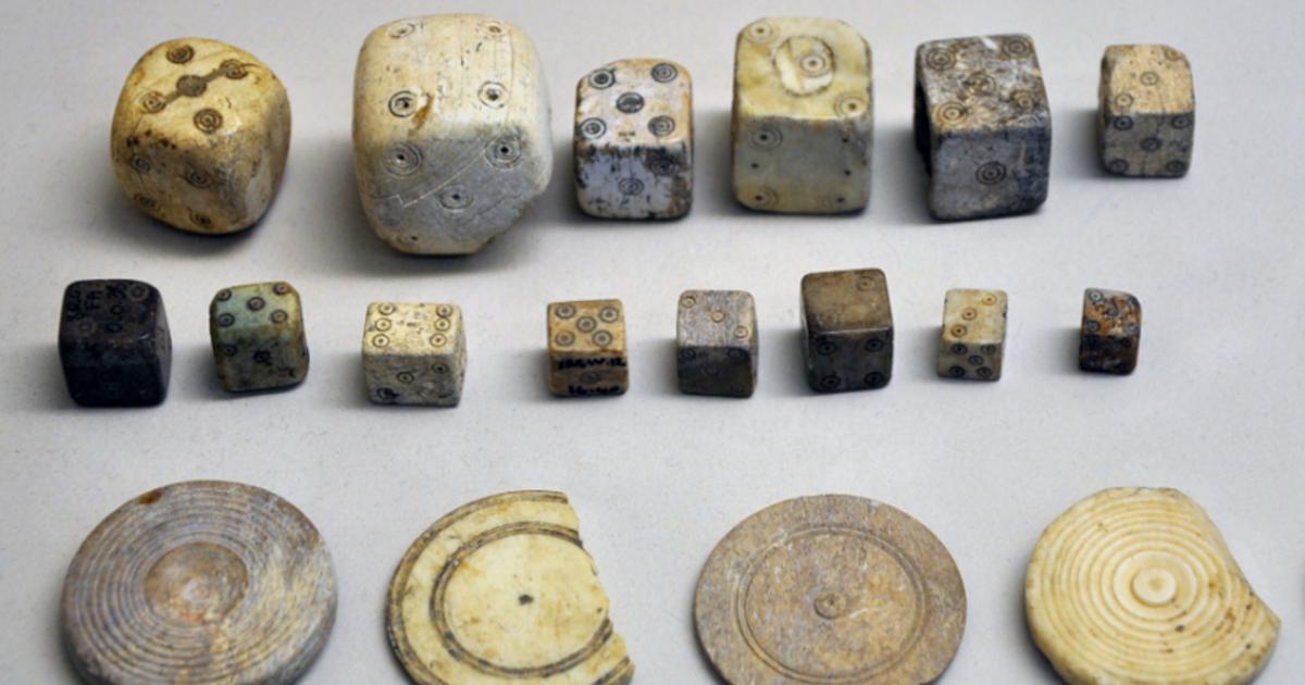 A collection of Roman bone dice and gaming counters from the Gallo-Roman Museum of Saint-Romain-en-Gal, France