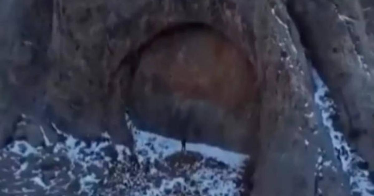 Drone footage showing the massive stone doorway formation in Kazakhstan's Dzungarian Alatau mountains