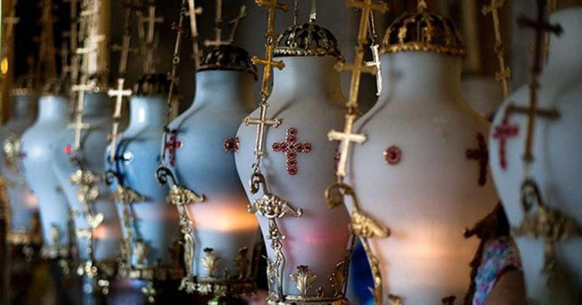 Vases hanging above The Stone of Anointing (Stone of Unction) in the entrance to the Church of the Holy Sepulchre. These vases contain water with rose essence.