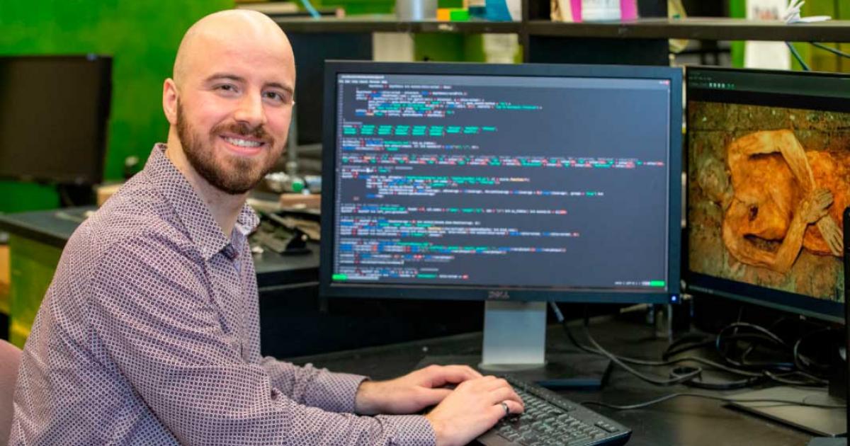George Long performing genomic data analysis on the mummy where the E. coli was detected. Source: Georgia Kirkos / McMaster University