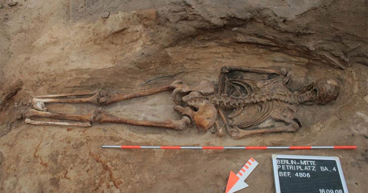Photograph of a face-down burial, also known as a prone burial, in a churchyard in Berlin, just one of almost a hundred medieval and post-medieval burials in Switzerland, Germany, and Austria included in the study. Source: (Claudia Maria Melisch / Landesdenkmalamt Berlin)